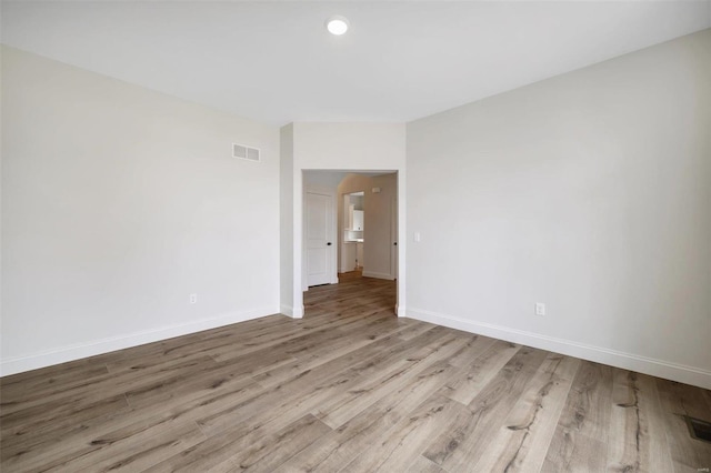 unfurnished room featuring light wood-type flooring