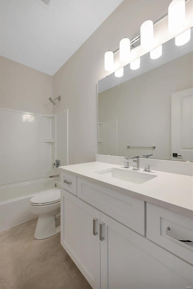 full bathroom featuring tile patterned floors, vanity, bathing tub / shower combination, and toilet