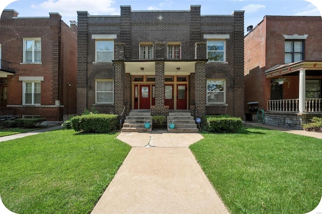 townhome / multi-family property featuring covered porch and a front lawn