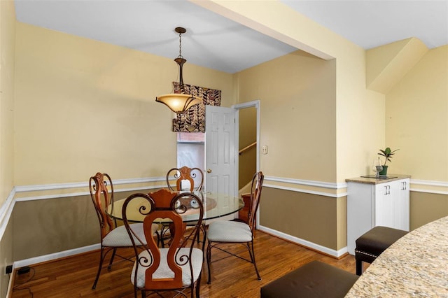 dining space with hardwood / wood-style floors