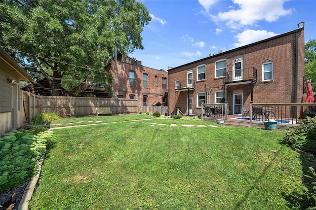 view of yard with a wooden deck