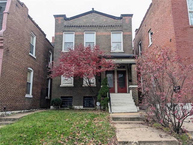 view of front of home featuring french doors and a front lawn