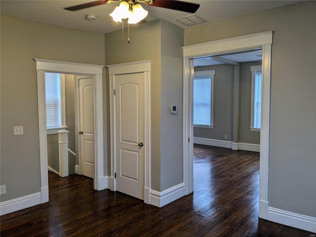 hallway with dark wood-type flooring