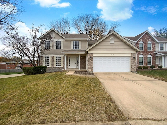 front facade with a front yard and a garage