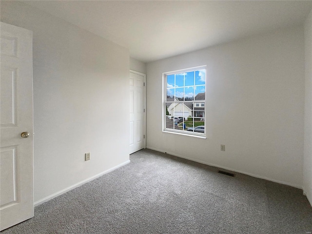 unfurnished room featuring carpet flooring