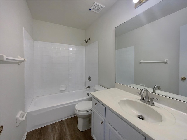 full bathroom with vanity,  shower combination, hardwood / wood-style flooring, and toilet