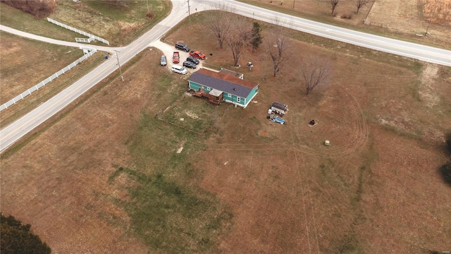 birds eye view of property with a rural view