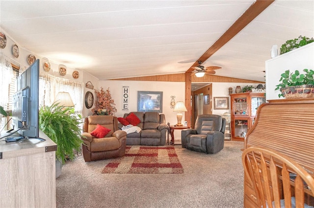 carpeted living room featuring ceiling fan and lofted ceiling with beams