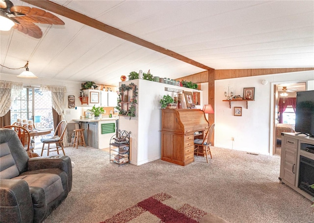 living room featuring lofted ceiling with beams and light carpet