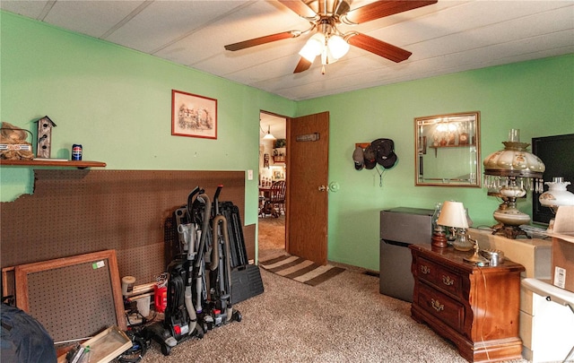 misc room featuring ceiling fan and light colored carpet