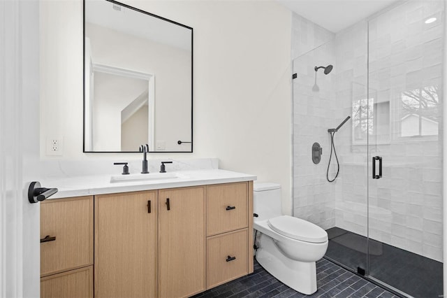 bathroom featuring vanity, tile patterned floors, toilet, and walk in shower