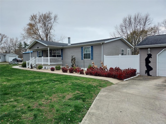 view of front of house with a garage, a porch, and a front yard