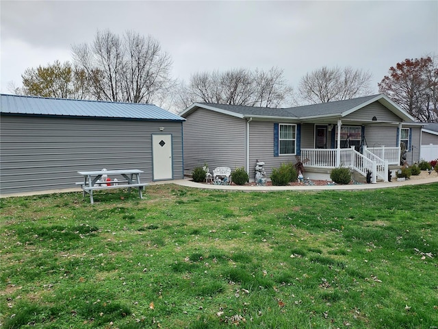 view of front of home featuring covered porch and a front yard