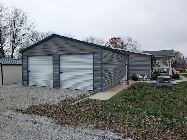 garage featuring a lawn