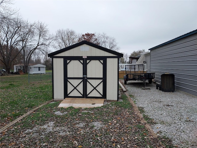 view of outbuilding with a yard