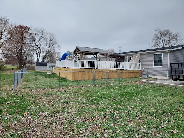 view of yard featuring a gazebo and a deck