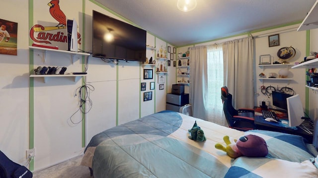 carpeted bedroom with lofted ceiling