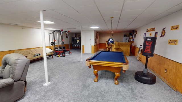 recreation room with wooden walls, light carpet, and billiards