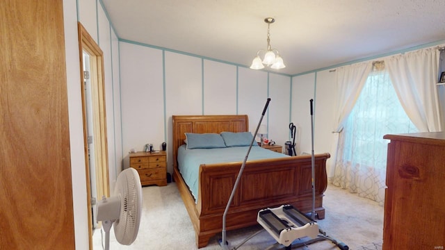 bedroom with light carpet and a notable chandelier