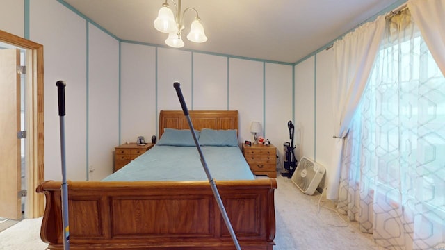 bedroom with carpet flooring and a notable chandelier