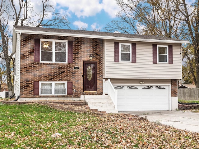 split foyer home with cooling unit and a garage