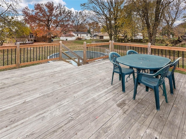 wooden deck featuring a yard