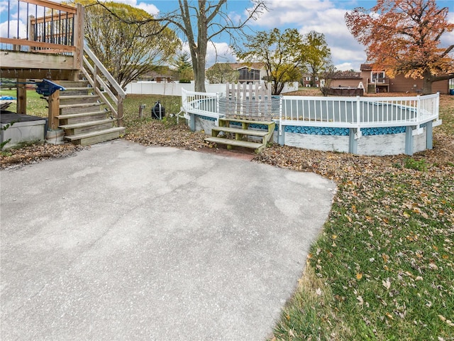 exterior space featuring a swimming pool side deck