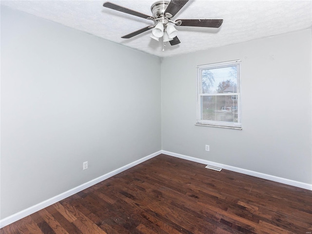 empty room with hardwood / wood-style floors, ceiling fan, and a textured ceiling