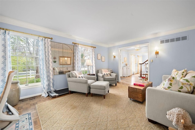 living room with parquet floors, plenty of natural light, and ornamental molding