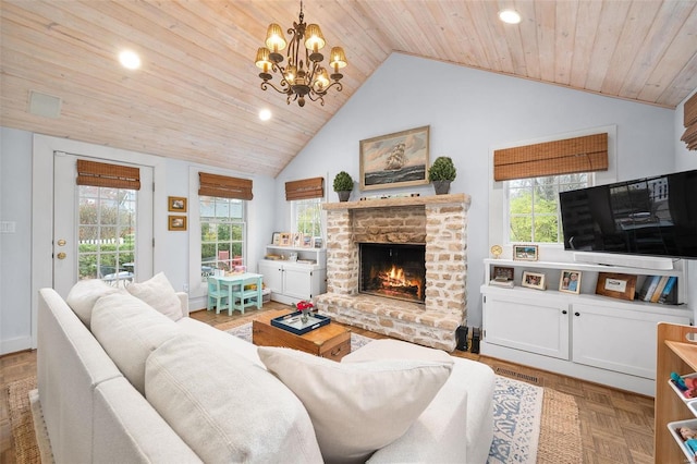 living room with vaulted ceiling, wood ceiling, a wealth of natural light, and a brick fireplace