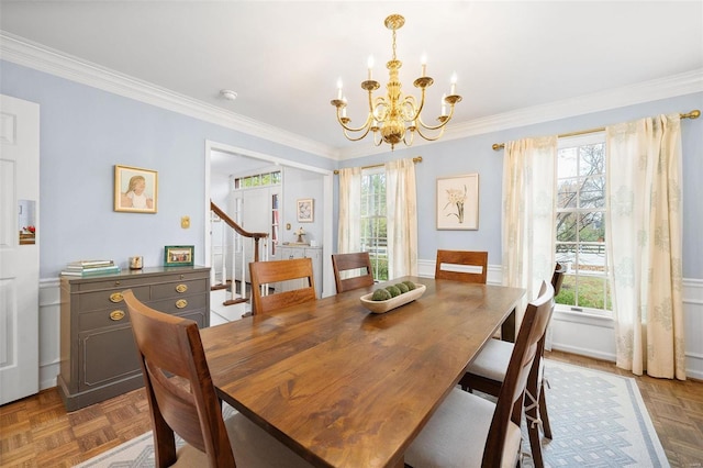 dining area featuring parquet flooring and a wealth of natural light