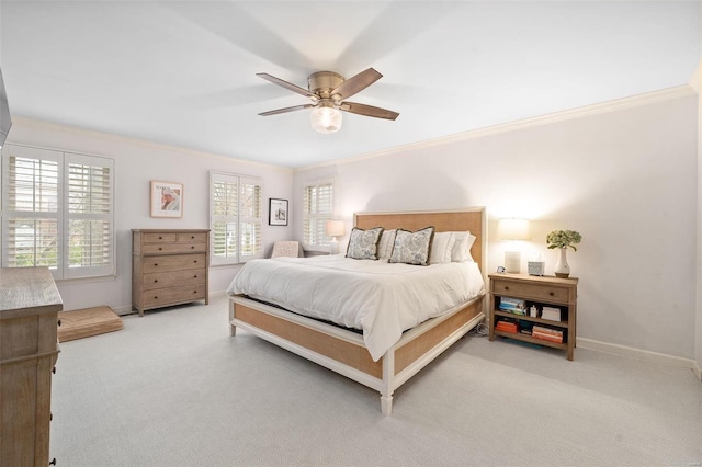 carpeted bedroom featuring multiple windows, ceiling fan, and ornamental molding