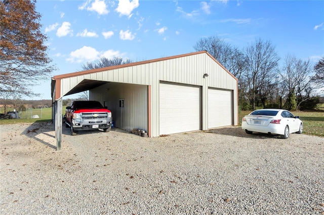 garage featuring a carport