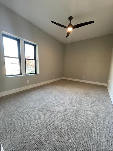 carpeted empty room with ceiling fan