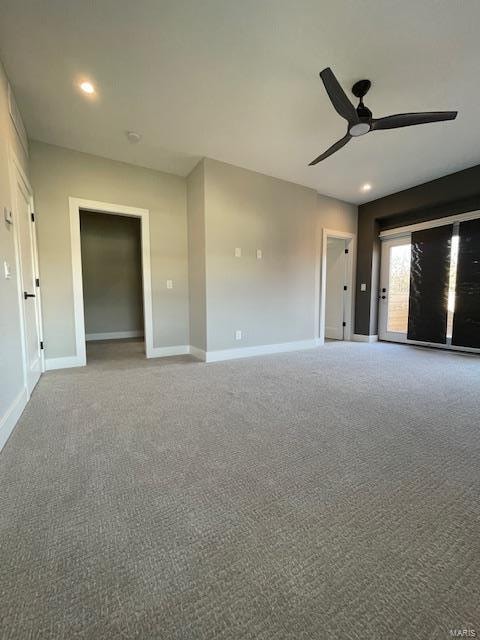 carpeted empty room with ceiling fan