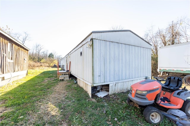 view of outdoor structure with a lawn