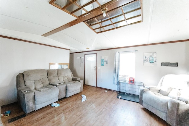 living room featuring hardwood / wood-style floors and vaulted ceiling