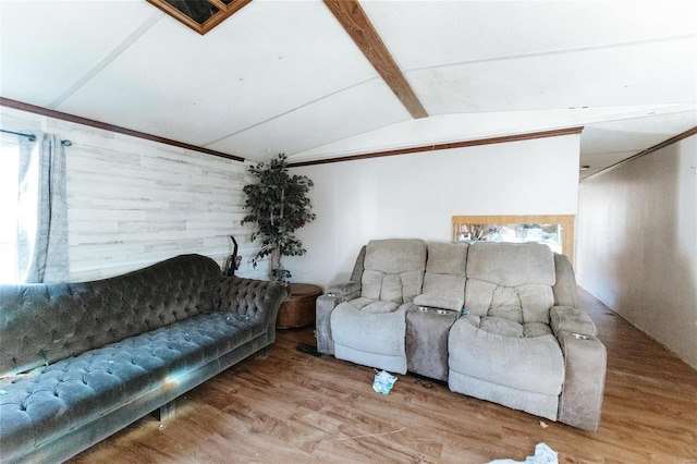 living room featuring wood-type flooring and lofted ceiling with beams