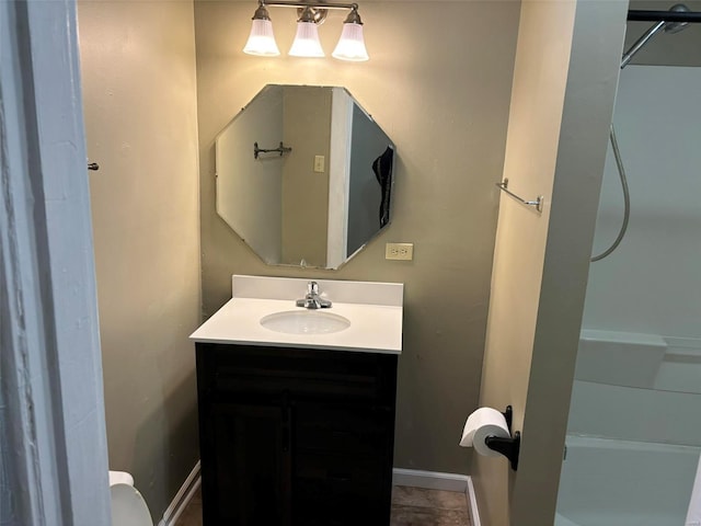 bathroom featuring tile patterned flooring and vanity