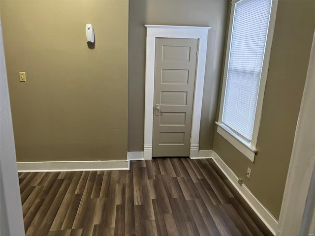 entrance foyer with dark hardwood / wood-style floors