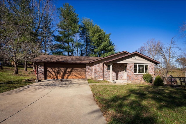 single story home featuring a front lawn and a garage