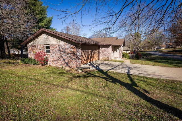 view of side of home with a lawn