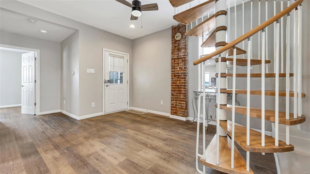 entrance foyer with recessed lighting, a ceiling fan, wood finished floors, baseboards, and stairs