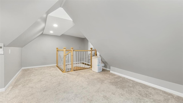 bonus room featuring lofted ceiling, baseboards, carpet flooring, and recessed lighting