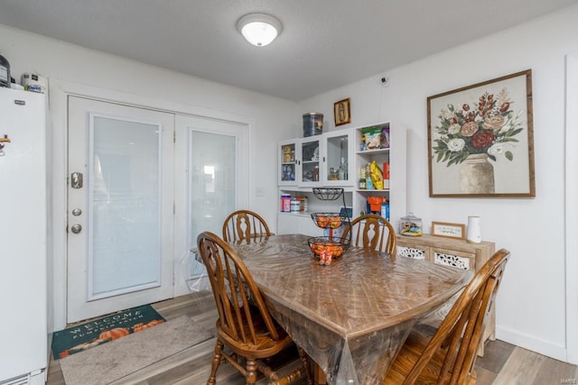 dining area featuring hardwood / wood-style flooring