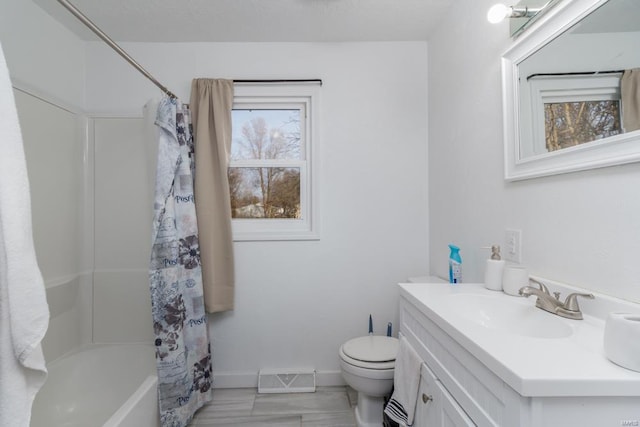 full bathroom with vanity, shower / bath combination with curtain, and toilet