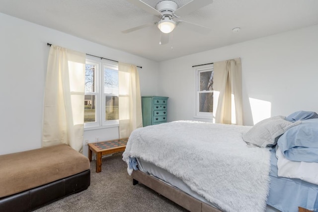 carpeted bedroom with ceiling fan