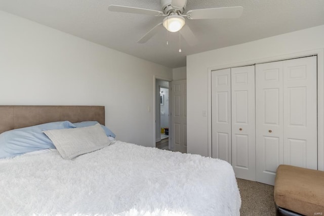 carpeted bedroom featuring ceiling fan and a closet