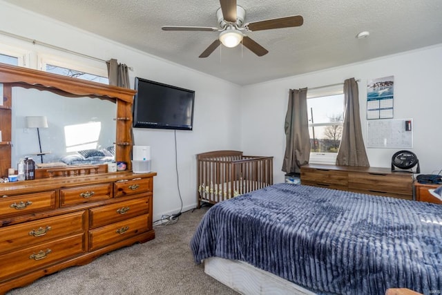 bedroom featuring light carpet, a textured ceiling, and ceiling fan