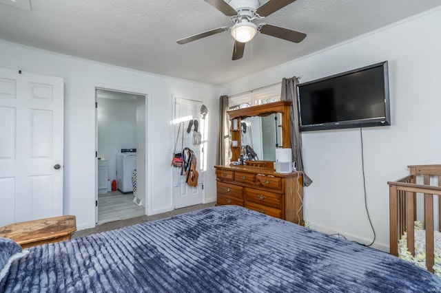 bedroom featuring ensuite bath, a textured ceiling, ceiling fan, hardwood / wood-style flooring, and washer / clothes dryer